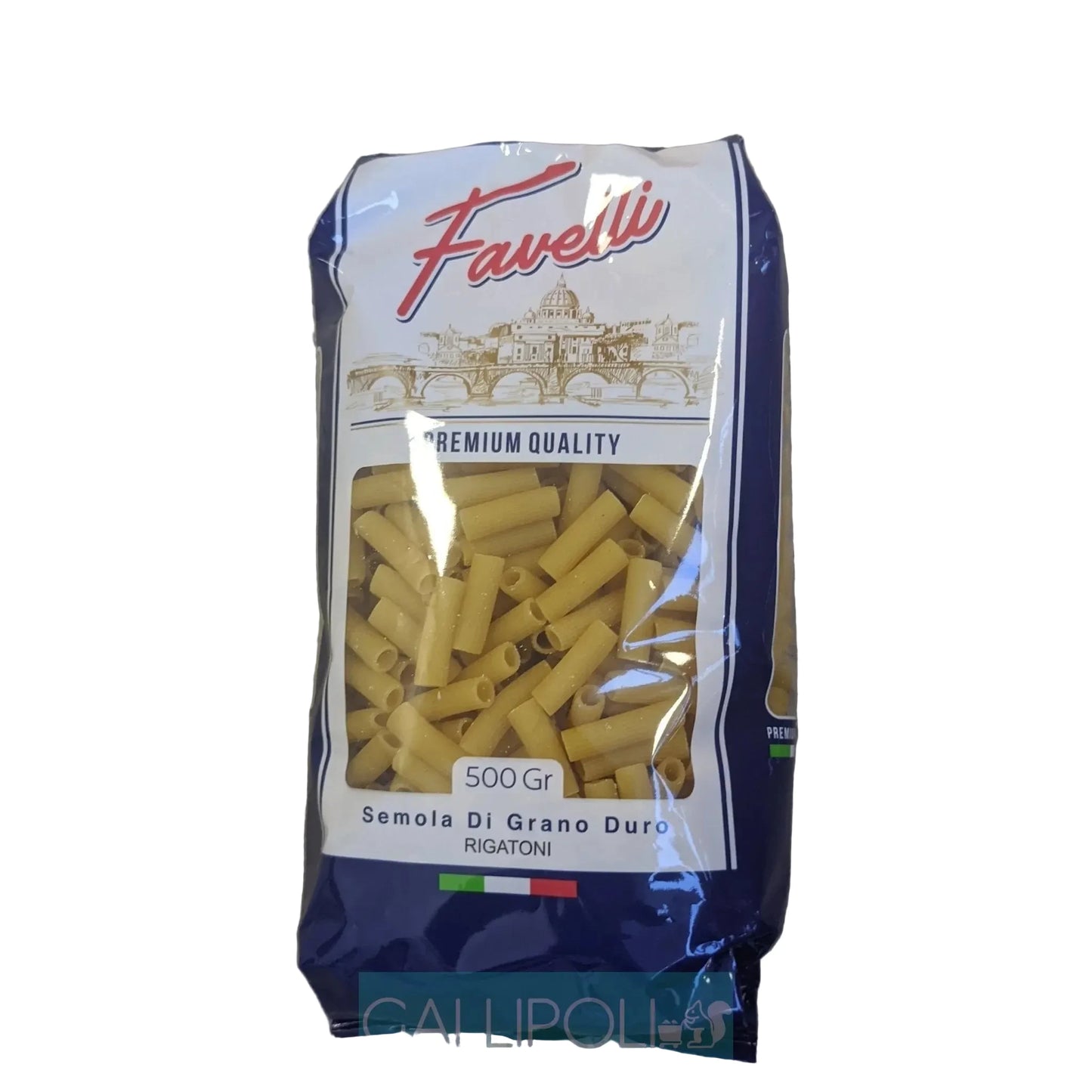 A 500g bag of Favielli Semola Di Grano Duro Rigatoni pasta, showing the yellow dry pasta through a clear window on a dark blue and white package, placed on a gray wood floor.